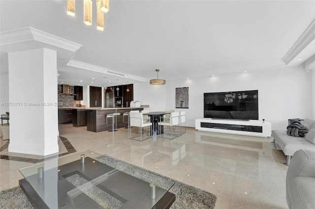 living room with ornamental molding