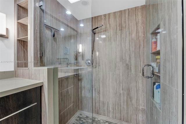 bathroom with vanity and an enclosed shower