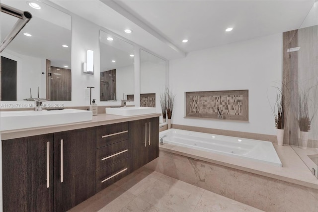 bathroom featuring vanity and shower with separate bathtub