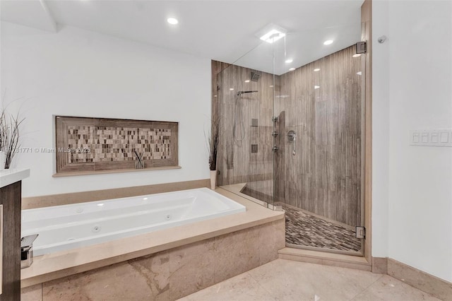 bathroom featuring tile patterned floors and shower with separate bathtub