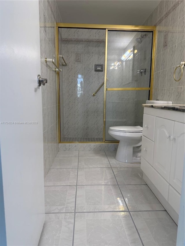 bathroom with walk in shower, vanity, and toilet