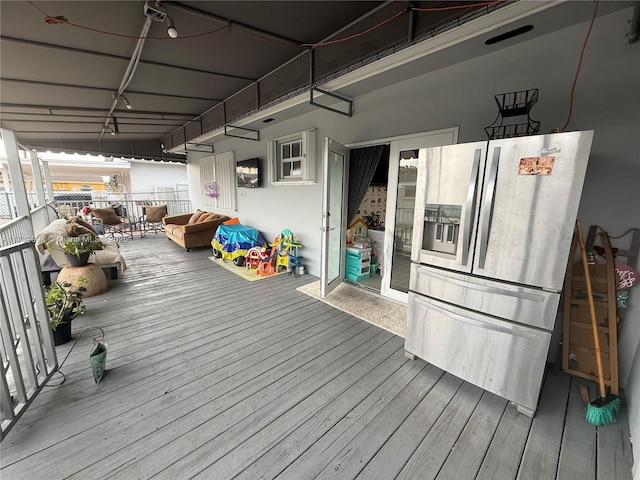 wooden terrace featuring an outdoor living space