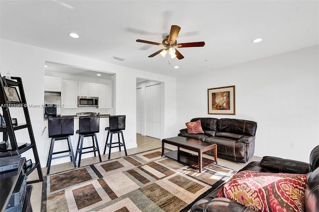 living room featuring ceiling fan