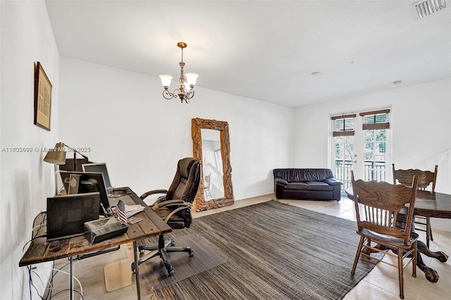 tiled home office with a notable chandelier