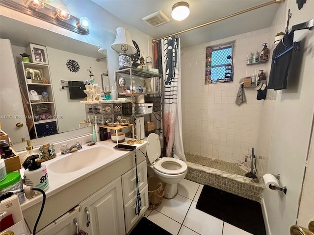 bathroom featuring a shower with curtain, vanity, toilet, and tile patterned flooring