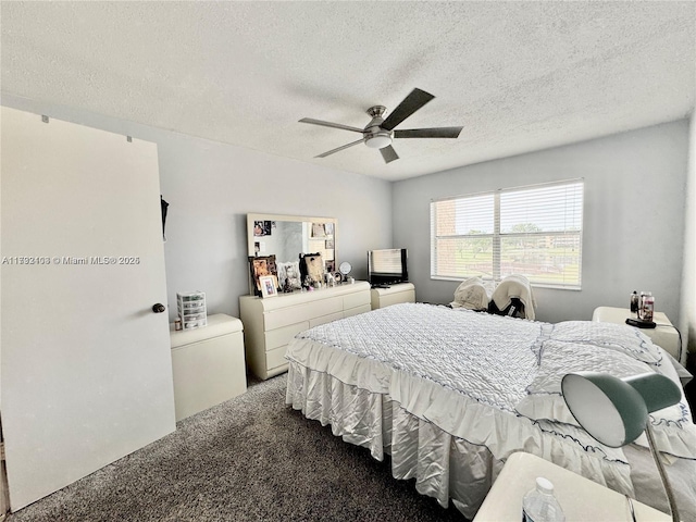 bedroom with carpet, a textured ceiling, and ceiling fan