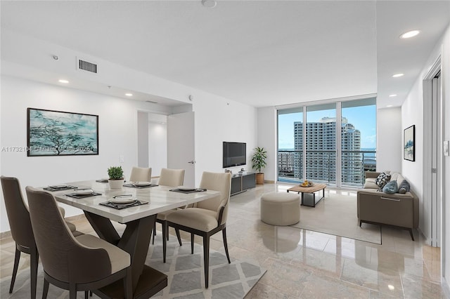 dining area featuring a wall of windows