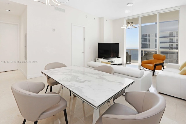 dining room featuring floor to ceiling windows