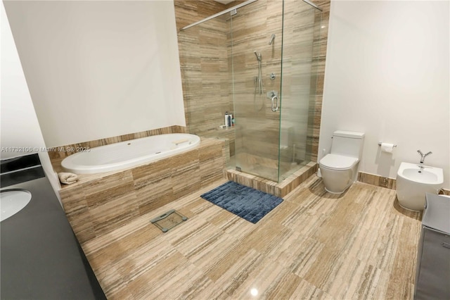 full bathroom with toilet, sink, a bidet, plus walk in shower, and hardwood / wood-style floors