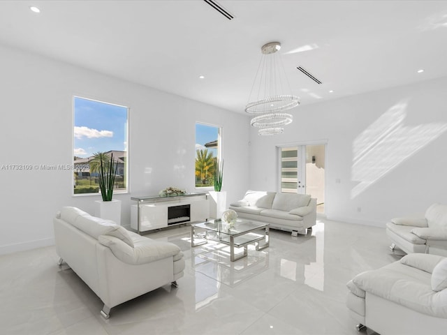 living room with a notable chandelier