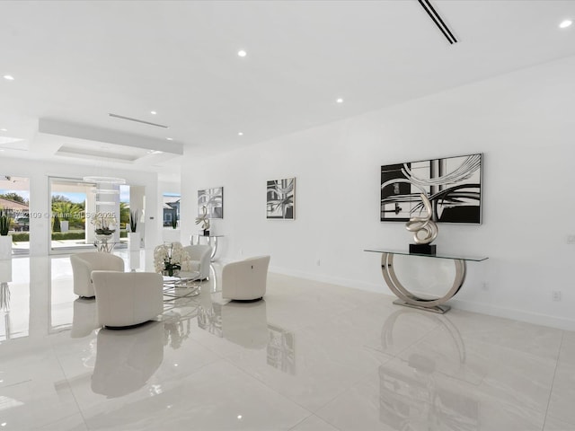 living room featuring a raised ceiling