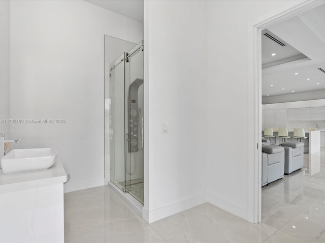 bathroom with vanity and an enclosed shower