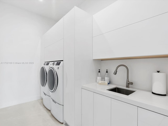 laundry area with cabinets, separate washer and dryer, and indoor wet bar