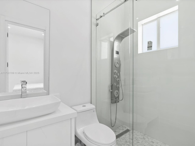 bathroom with vanity, an enclosed shower, and toilet