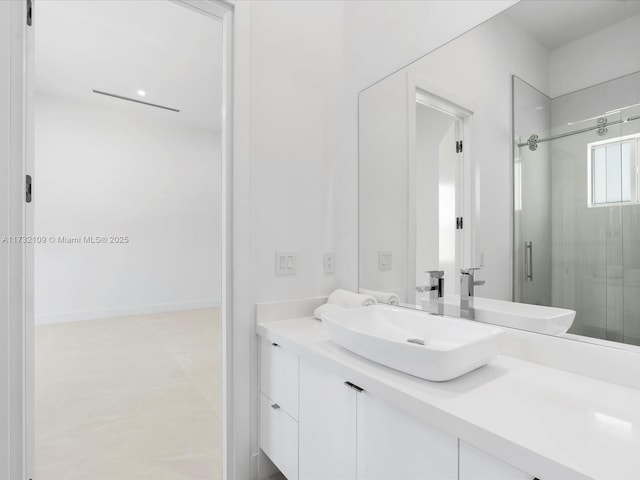 bathroom featuring vanity, tile patterned flooring, and a shower with door