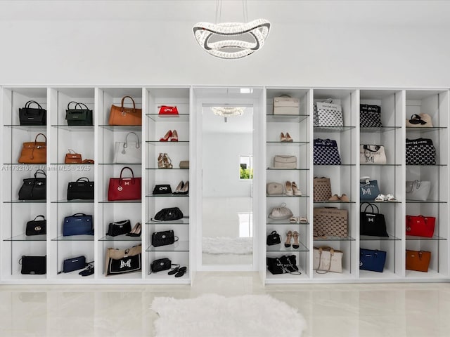 interior space featuring light tile patterned floors and a notable chandelier