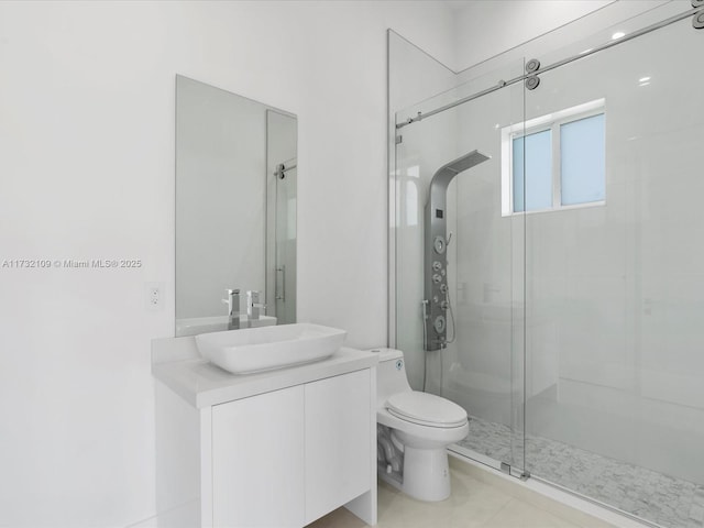 bathroom with vanity, an enclosed shower, tile patterned floors, and toilet