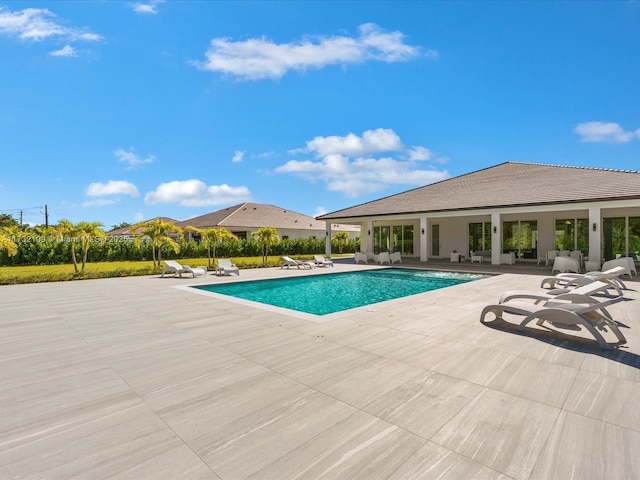 view of pool featuring a patio