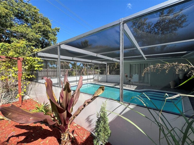 view of pool featuring a lanai and a patio