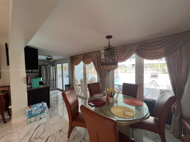 dining space with plenty of natural light