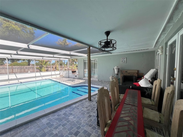 view of pool with a patio, a lanai, and ceiling fan