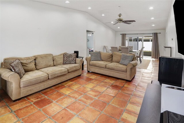 living room with lofted ceiling, tile patterned floors, and ceiling fan