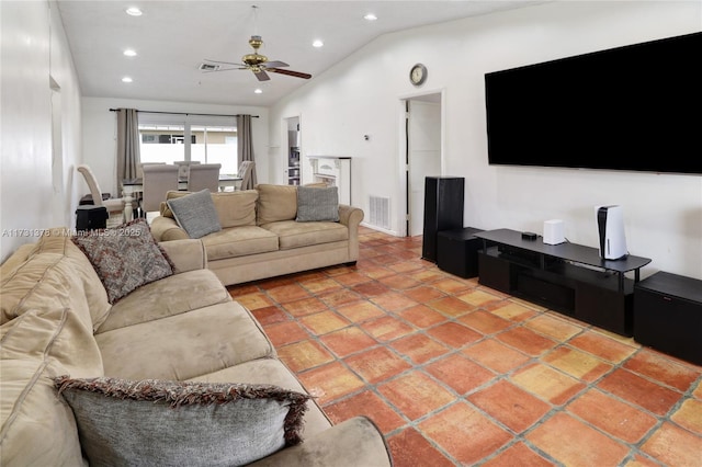 living room featuring vaulted ceiling, tile patterned floors, and ceiling fan