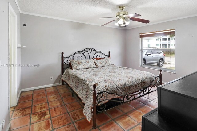 bedroom with ornamental molding, ceiling fan, and a textured ceiling