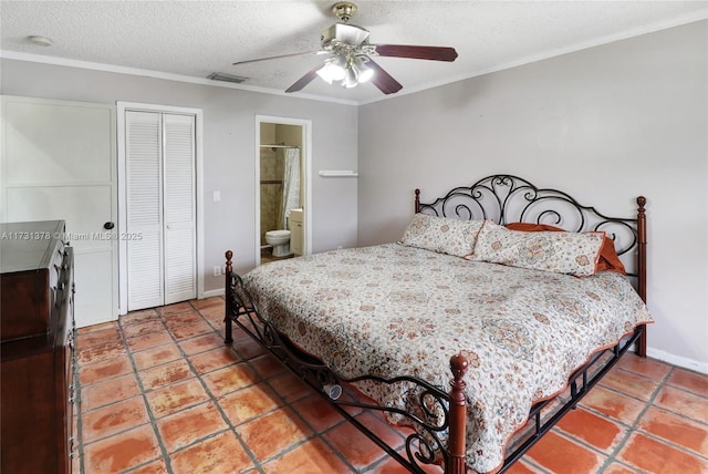 tiled bedroom with connected bathroom, ornamental molding, ceiling fan, a textured ceiling, and a closet