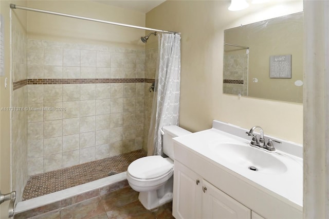 bathroom featuring a shower with curtain, vanity, and toilet