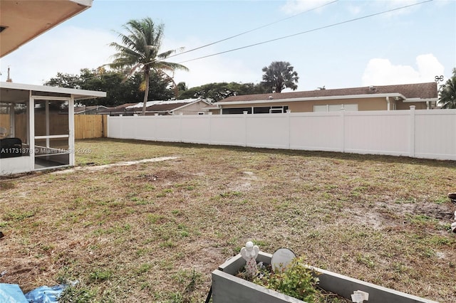 view of yard with a sunroom