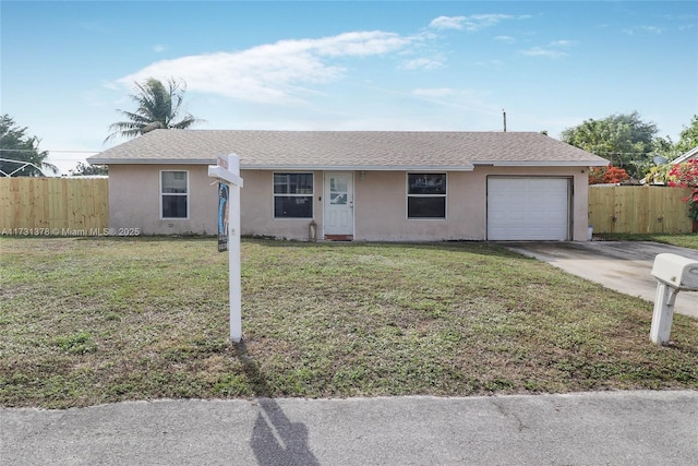 single story home featuring a garage and a front lawn