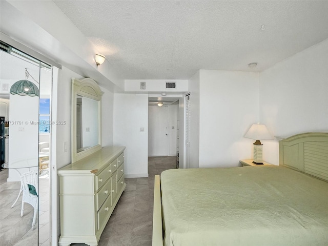 bedroom featuring a textured ceiling