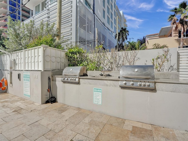 view of patio featuring sink, grilling area, and an outdoor kitchen