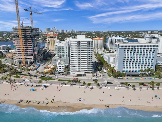 bird's eye view with a view of the beach and a water view