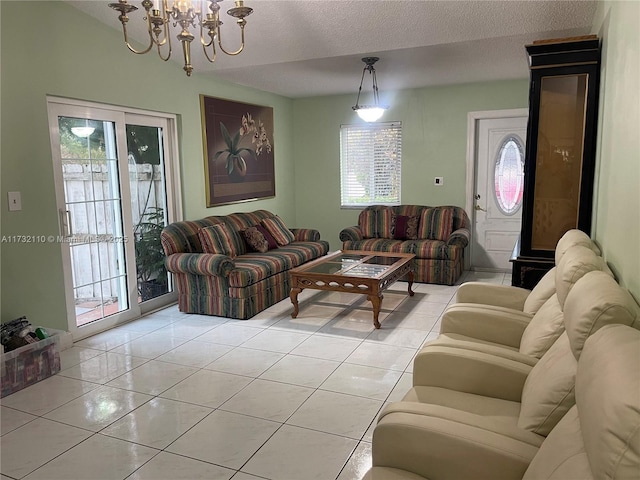 living room featuring a textured ceiling and light tile patterned floors