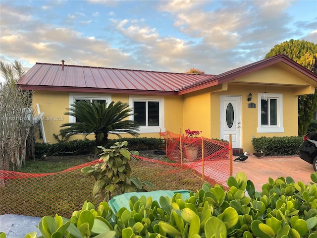 rear view of property featuring a patio area