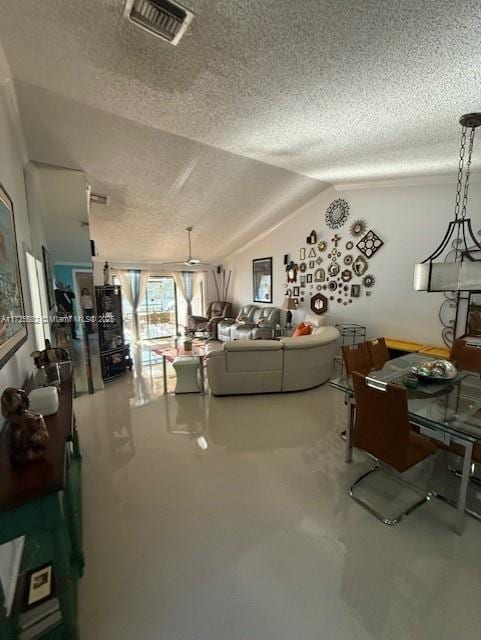 unfurnished living room with concrete flooring, vaulted ceiling, and a textured ceiling