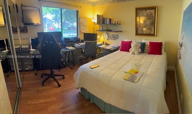 bedroom featuring hardwood / wood-style flooring