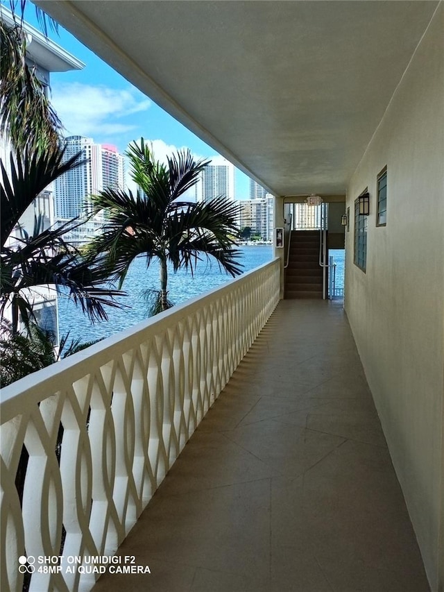 balcony featuring a water view