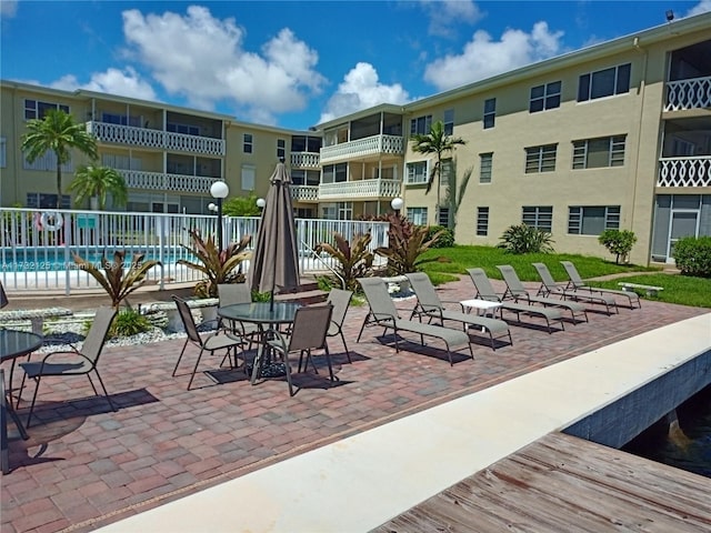 view of patio featuring a community pool