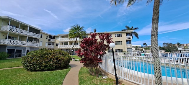 view of pool featuring a yard