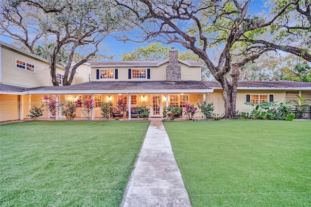 view of front of house featuring a porch and a front lawn