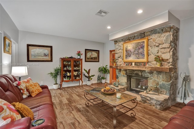 living room featuring hardwood / wood-style floors and a fireplace