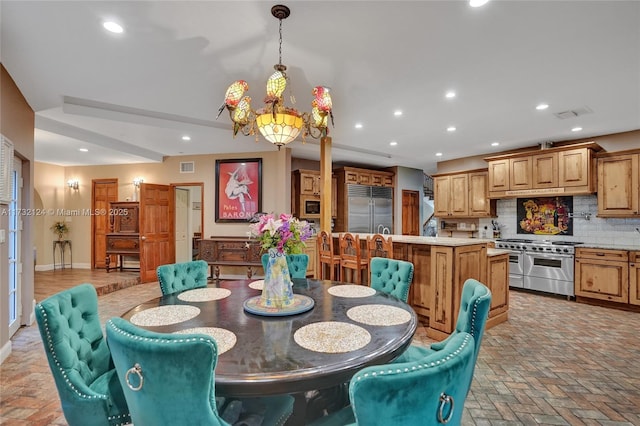 dining room with a notable chandelier