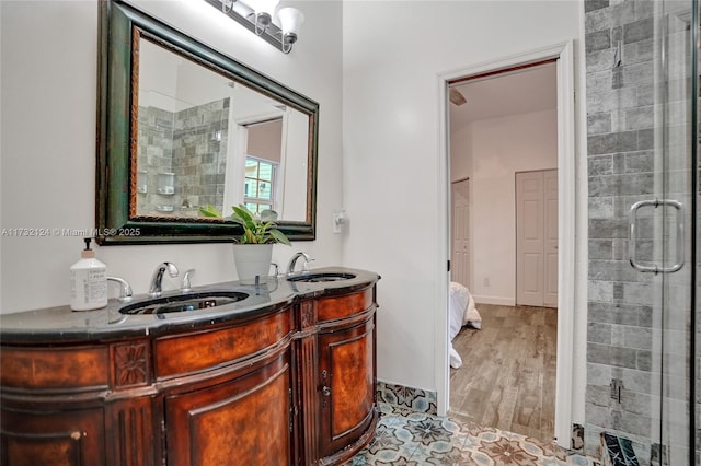 bathroom with vanity and an enclosed shower