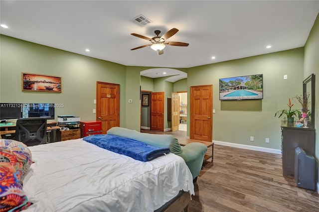 bedroom with ceiling fan and wood-type flooring