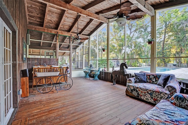 sunroom with wood ceiling, ceiling fan, and vaulted ceiling with beams