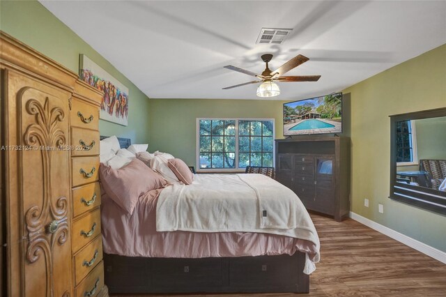 bedroom featuring hardwood / wood-style flooring and ceiling fan