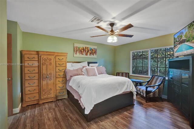 bedroom featuring dark hardwood / wood-style floors and ceiling fan